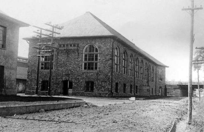 Credits to the Monroe Historical Society The powerhouse shortly after it was constructed. Notice the large amount of wires and insulators that feed out of the upper window and the road that does not exist anymore between the powerhouse and the building on the left hand side. Also, the bridge in the background carries the Erie railroad mainline over Route 17. It was replaced with a higher bridge in 1932.