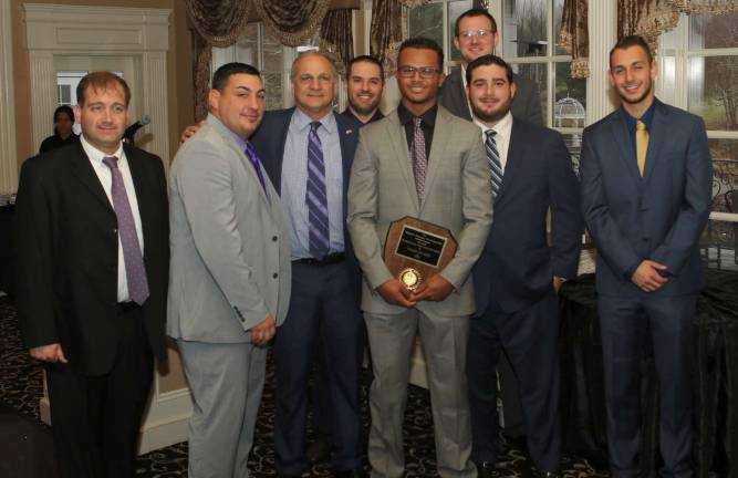 Tyler Toledo receives his Micheal J. Finnegan Award Scholarship award with, from left to right: Steve Angel, Dave Colabella, Tony Cardone, Ryan Baldock, Tyler Toledo, Brett Van De Weert, Jordan Bari and James D&#x2019;Alessio.