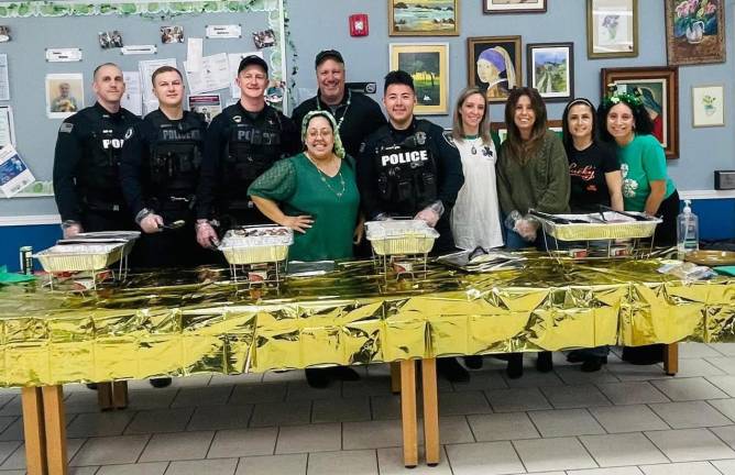 Members of the Woodbury Police Department, Orange County District Attorney along with Woodbury Supervisor Kate Luciani, Deputy Supervisor Teresa Luongo and Town Councilwoman Kelly Rinaldi, Senior Activity Leaders Alex Arriaga and Aleah Camilo all about to serve seniors for St. Patrick’s Day.