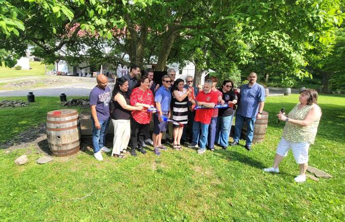 Local dignataries and community leaders celebrate ceremonial ribbon cutting at Sweet Clover Farm to kickoff America 250 celebrations.