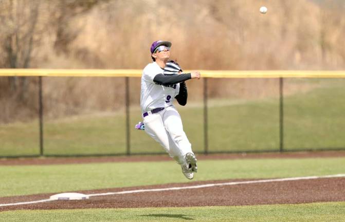 Evan Erickson makes the long throw from third to nail a Warrior runner in the sixth inning.