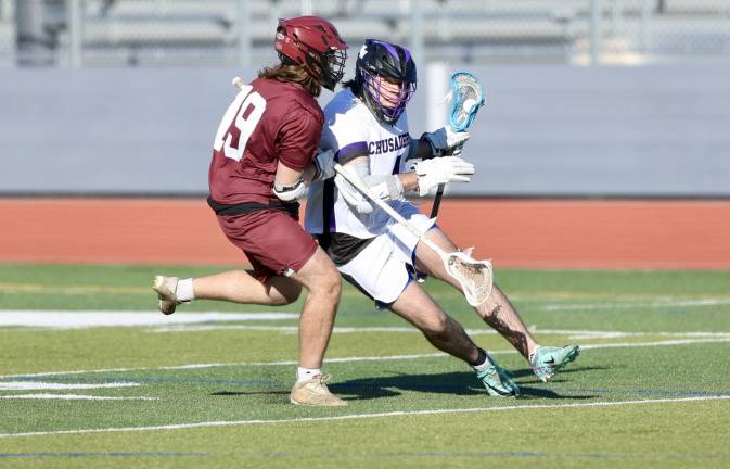 Ryan Behringer (#4) pushes his way around a Huguenot defender. Photos by William Dimmit.