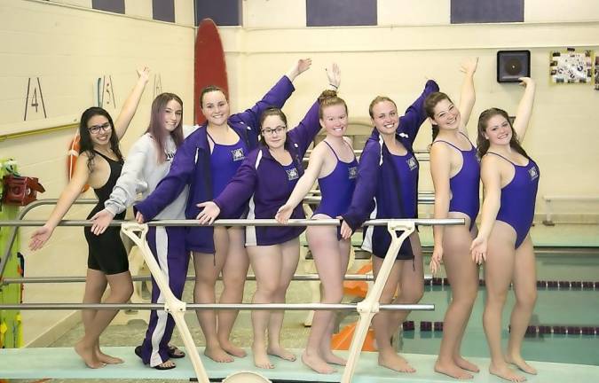 Swim and Dive team seniors, from left to right on this diving board, are: Sophia Kholbecker, Dive Captain Emma Herbst, Swim Captain Emma Khorassani, Cristen Wolff, Captain Claire Armstrong, Captain Jessica O’Brien, Chloe Quinn and Captain Jessica Ebner.
