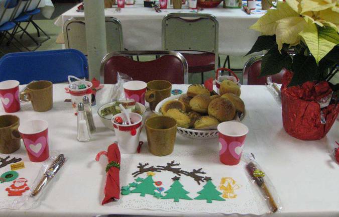 Table settings such as this one in 2016 are made by Girl Scout troops and other groups wanting to be a part of the effort.