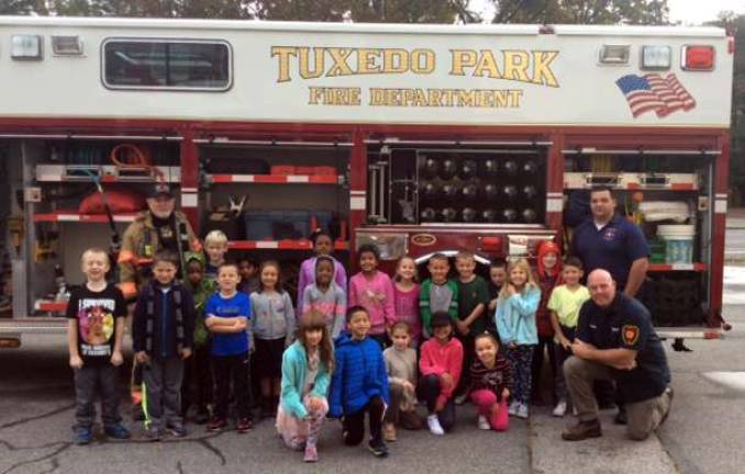 Provided photo Members of the Tuxedo Fire Department are pictured here with the second grade students at the George Grant Mason School during a fire prevention program earlier this month at the school.