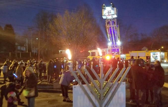 The Monroe Joint Fire District performs a ‘Chanukah Miracle’ and drop thousands of Chanukah Gelt (chocolate coins) from a firetruck along with menorah and dreidel parachutes.