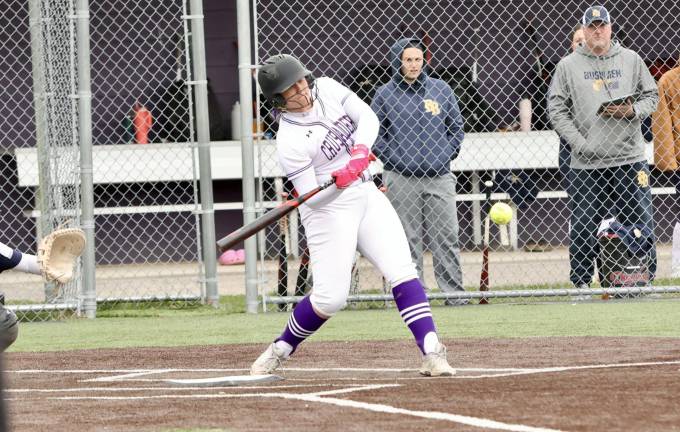 Cori Exarchakis hits her grand slam in the seventh inning.