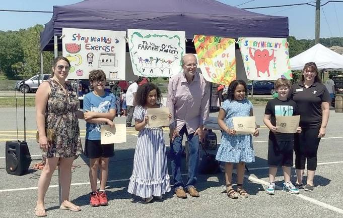 Monroe Village officials with the winners of the health and wellness poster contest from North Main Elementary School.