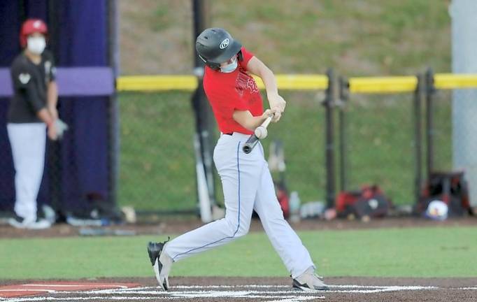 Timmy Kirkpatrick drives the ball to center field for a hit. Photos by William Dimmit.