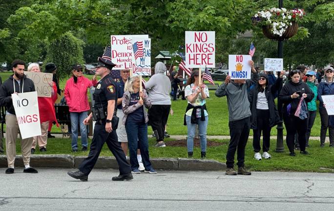 Village Police were on hand to direct traffic and help protesters cross busy roadways near the protest in Goshen.