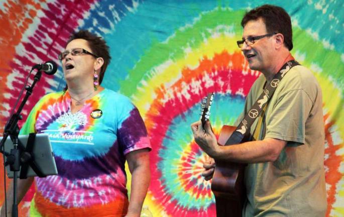 Palaia Vineyard owner Jan Palaggi, in tie dye, singing the Jefferson Airplane&#xed;s &#xec;White Rabbit&#xee; at a recent event at the winery, accompanied on guitar by Rob Schiff. Both will be performing at the Neil Young Tribute Festival on Sept. 2.