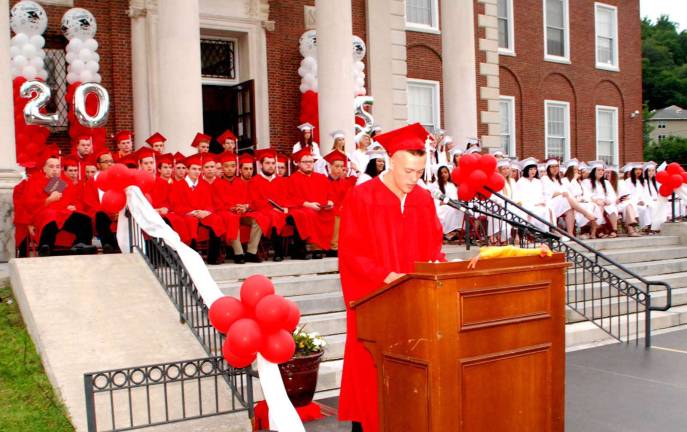 In his farewell remarks, Zachary Messick presented a rubber chicken to Principal Art Schouten.