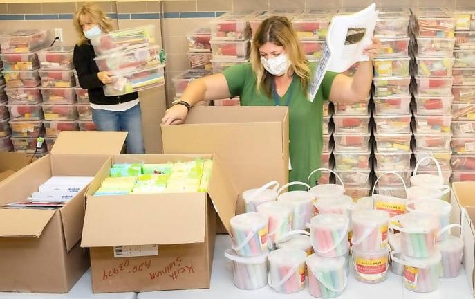 Orange-Ulster BOCES staff members pack summer school kits at the Regional Education Center at Arden Hill in Goshen.