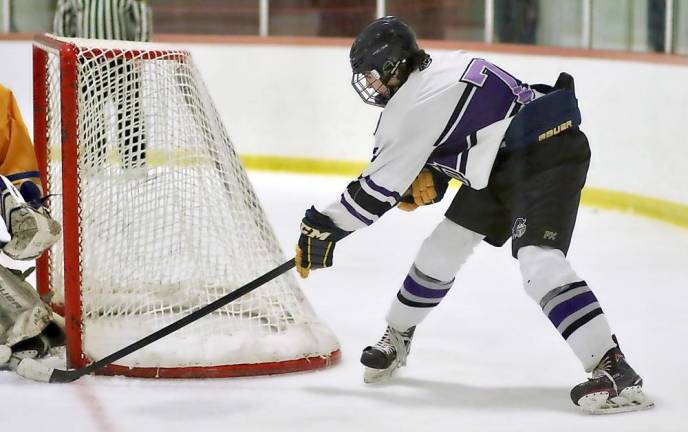 Game winner: Eddy Dovgan sneaks the puck between the post and the goalie to put the Crusaders ahead for good.