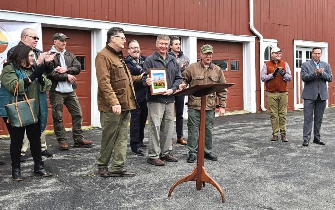 The Palmer family was presented with an illustration of the mountain as thanks for their support.