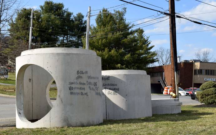 Materials marked &quot;Smith Farm&quot; can be seen along the sides of Gillbert Street, in thsi case, next to the Burger King parking lot.