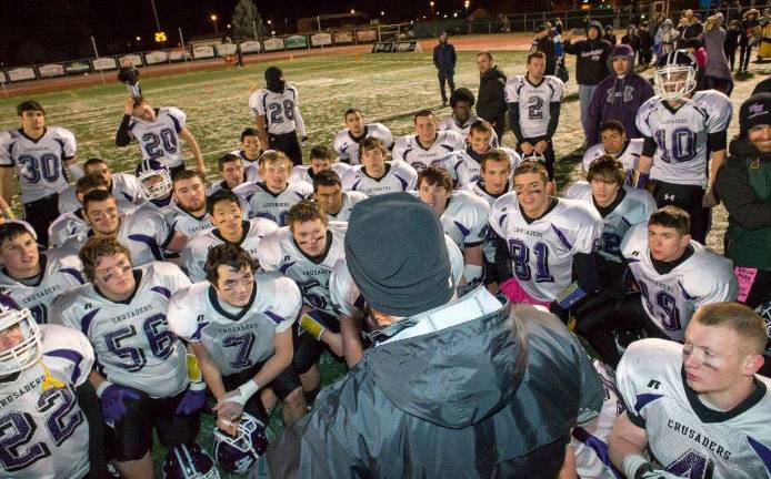Coach Bernie Connelly takes a moment to congratulate the players on all their hard work.
