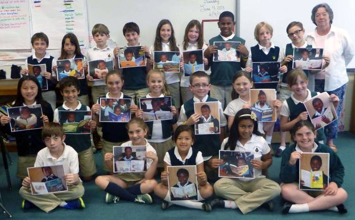 Showing photos of the South African students who are the beneficiaries of the Tuxedo Park School third-grade &quot;Coins for Change&quot; project with Tuxedo Park resident Sue Heywood are, in the front row and from the left: Jacob Berry, Isabella Croce, Maliah Utley, Aryana Ramos-Vazquez and Courtney Swingle. Middle row: McConn Honor, left, Serdar Kaltalioglu, Samantha Emr, Raquel Zona, Jace Howhannesian, Cassandra Beckmann and Piper Jenkins. Back row: Sean Coen, left, Jordan Kotch, Matthew Harper, Matthew Biamonte, Megan Donaghy, Eva Galbraith, Justin Romeo, Nicholas Hansen and Paris Liston.