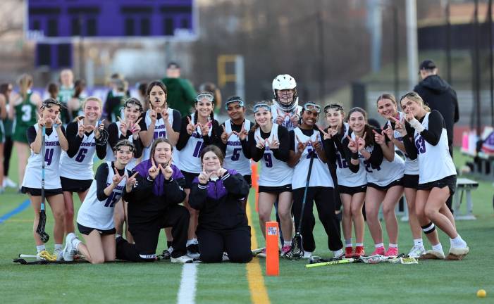 The Crusaders celebrate their 13-7 opening day victory against Cornwall on March 25.