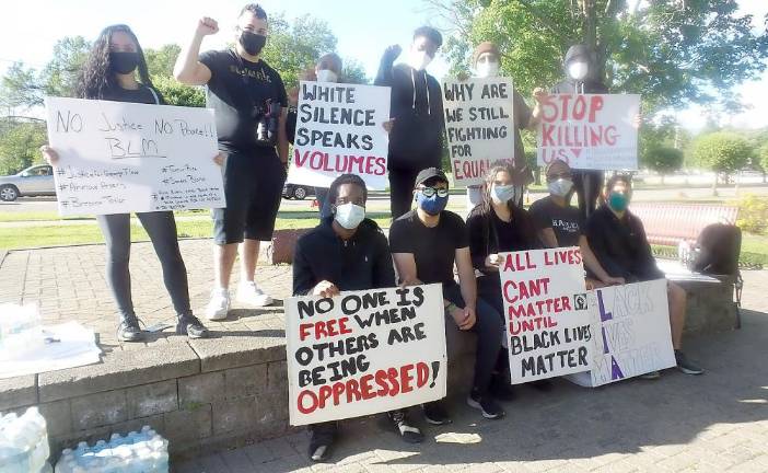 Organizers of Sunday’s rally were Monroe-Woodbury High School Alumni. Left front: Tyjai Lewis, Rich Toro, Suhi Saran, Shelby Seth and David Eantos; Left back: Julianna Trentin, Chris Omar, Sky Arroyo, Torry McCoy, Marc Futo and Josh Berdecia. Photos by Frances Ruth Harris.