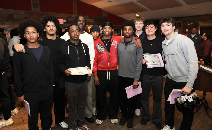 Members of the Boys Varsity team celebrate another season.