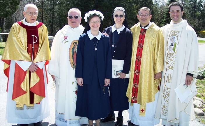 On April 14, Sister Susan Marie Norton, P.V.M.I. made her perpetual profession of vows as a Parish Visitor of Mary Immaculate at Marycrest Convent, the congregation&iacute;s Motherhouse in Monroe. Pictured here, from left to right, are: the Rev.Joseph Doran; Msgr. John Paddack, Sr. Susan Marie Norton; Sr. Carole Marie Troskowski; The Rev. Kazimierz Chwalek; and teh Rev. Christopher Argano.