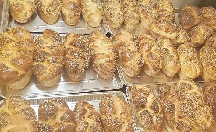 Loaves of homemade fluffy Challah for the “Chicken Soup &amp; Challah for the Quarantined Soul” packages.