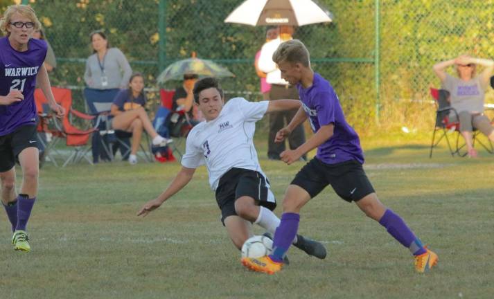 Christopher Ryan (#17) dives and gets the ball away from the Wildcat player late in the game.