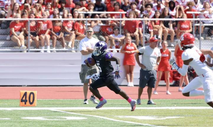 Nate Coulanges races 63 yards for a Crusader touchdown in the second quarter of Saturday’s game against North Rockland.