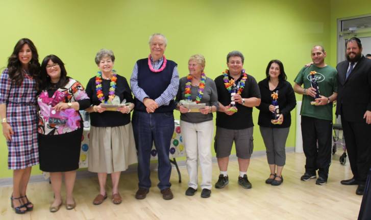Chabad presents gifts to Chabad Hebrew School staff and volunteers (from left): Malka Neuhaus of South Fallsburg, Phyllis and Gil Goetz of Monroe, Iris Sasson of Monroe, Sid Hershkowitz of Highland Mills, Lorie Ingber of Goshen, and Phil Reich of Highland Mills (Photo provided)