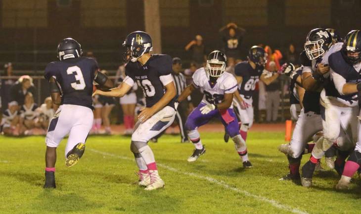 Last stop: Crusader Dylan Wynn (#22) zeros in on the Pine Bush running back and stops the Bushmen's attempt to tie the game.