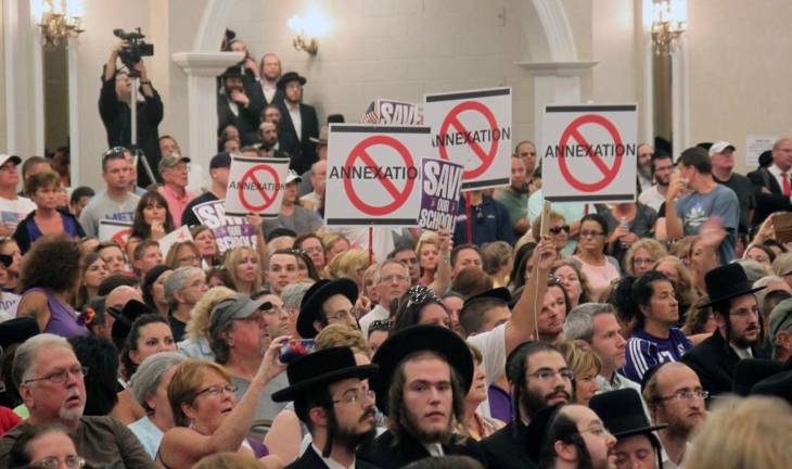 Photo by Linda Mastrogiacoma By most accounts, there were more than 1,000 people inside - and up to 500 outside - of the Bais Rachel Paradise Banquet Hall in Kiryas Joel when the Monroe Town Board voted on annexation proposals last September.