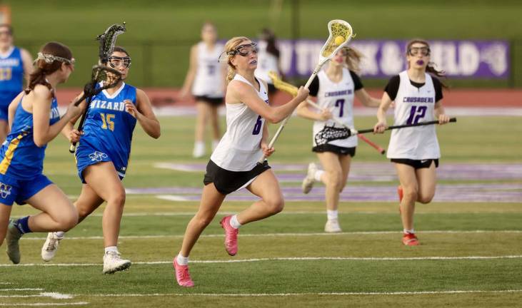 Kyra Gilligan runs past Wizard defenders. Photos by William Dimmit.