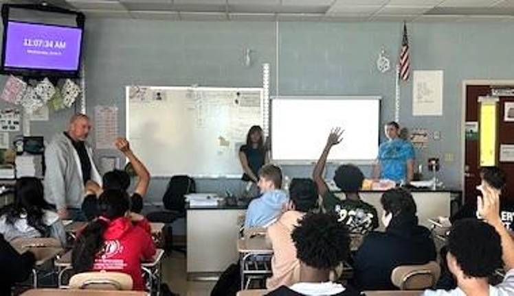 Monroe-Woodbury High School students Mia Flores and Nolnaree Chada give a presentation on the impacts of traditional gemstone mining.