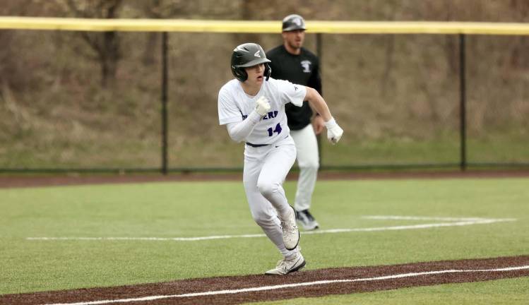 Liam Hayes scores in the first inning after hitting a triple.