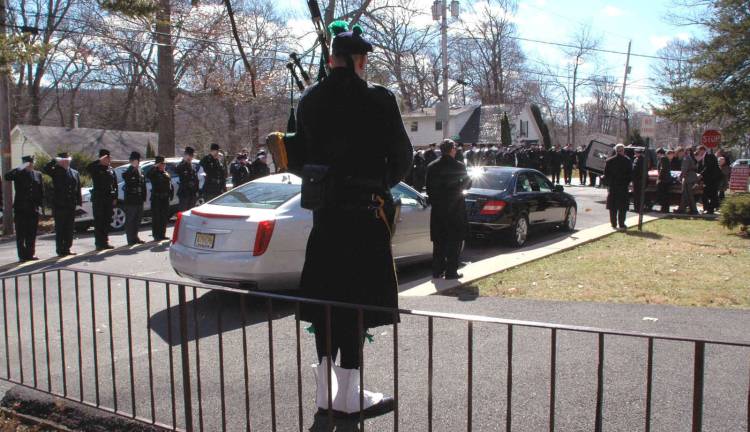 NYPD bagpiper Eamon Nugent from 46 Precinct of the Bronx.
