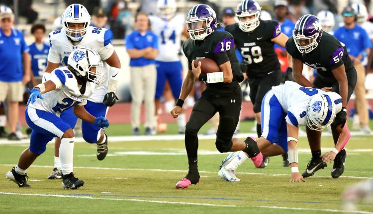 Monroe-Woodbury quarterback Ethan Maldonado (#16) ran for one touchdown and threw for two more against Middletown on Oct. 3 in Monroe.