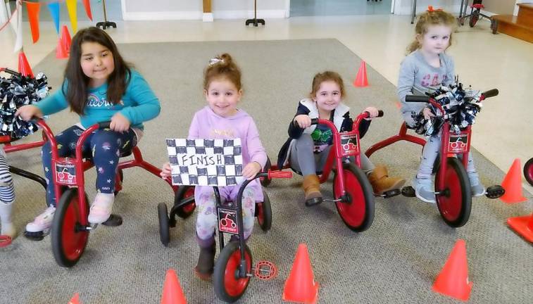 Ms. Katrina Powers' 4's class crosses the finish line: From left to right are: Alyssa Mamudoski, Adriana Gennaro, Madison Kearney and Hannah Hynes.