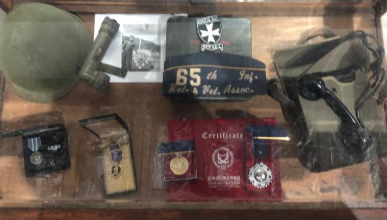 Artifacts from the 65th Infantry U.S. Army Puerto Rican Regiment, were displayed in the museum, showcasing photography, clothes, and weaponry.
