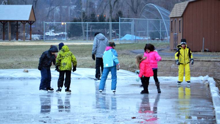 Children skate at the rink adjacent to the Powerhouse property in the Town of Tuxedo last Saturday afternoon.