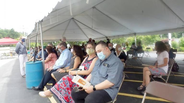 Family and friends wait for the ceremony to begin.