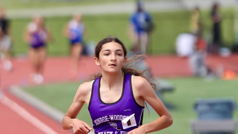 Molly Connolly set a meet record in the 100 meter dash with a time of 12.23.