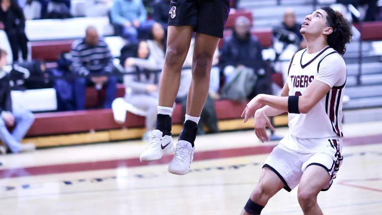 M-W’s Kristopher Bjaelker (#1) led the Crusaders comeback victory in Kingston by scoring six of his nine game points in the game in the fourth quarter.