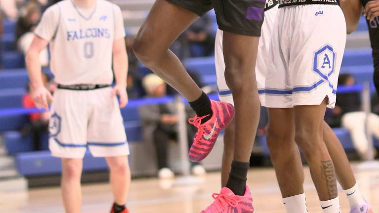 M-W’s Fabrice Ndja scores in the third quarter against the Albany High School Falcons on Jan. 24.