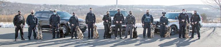 Nine handlers and their K-9 partners graduated last week from the Orange County Sheriff’s Office K-9 Detector School. Included in the group was Officer Melissa C. Berke of the Village of Monroe Police Department, pictured here with her K-9 Keen third from the right.