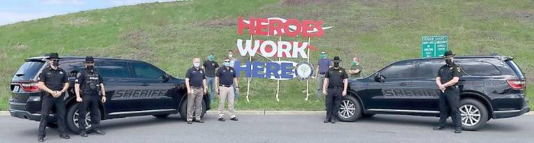 Pictured from left to right are: Sgt. Andrew Frank, Sgt. Justin Butterfield, Deputy Commissioner Craig Cherry, Commissioner Brendan Casey, Sheriff Carl E. DuBois and Captain Paul Arteta; and in back: Royce Durgin, Logan Barth, Ben Barth and Joel Marchant.