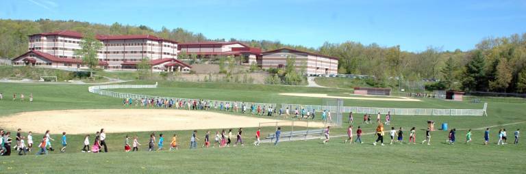 Children return to Central Valley Elementary following an evacuation drill last Tuesday.