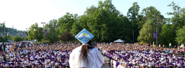 Photo by William Dimmit Salutatorian Jordan Castro speaks to her classmates during Monroe-WoodburyþÄôs 65th commencement last Friday evening. More than 4,000 people were in attendence.