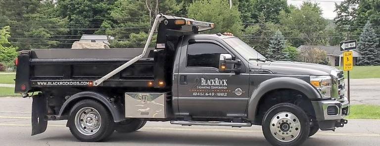 Black Rock Excavating in Cornwall delivers a , 1.5 ton boulder, gifted to the Pine Tree PTA by Callahan and Nannini Quarry in Salisbury Mills, and plopped it on the elementary school’s front yard.