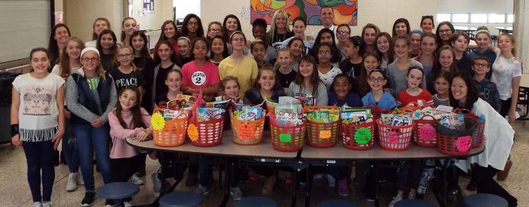 Photos provided by Carole Spendley M-W Middle Schools students recently stayed after school to compile more than 60 baskets for pediatric cancer patients.